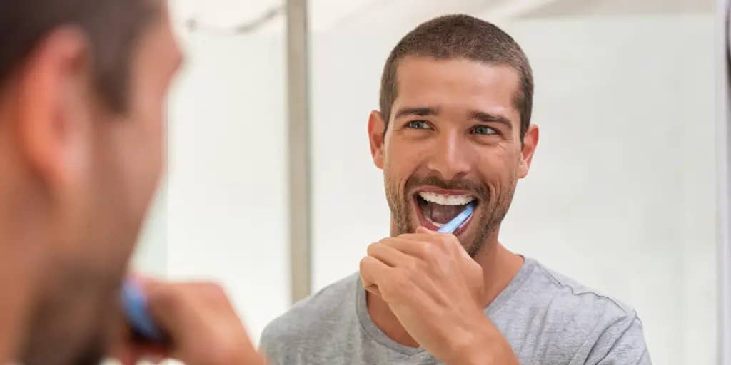Natural Toothpaste and Holistic Oral Care brushing teeth